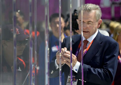 IOC President Jacques Rogge signs the Olympic Wall of Truce to mark the 40th anniversary of deadly attacks on Israeli athletes at the 1972 Munich Games during a visit to the Olympic Village in London four days before the start of the London 2012 Olympic Games