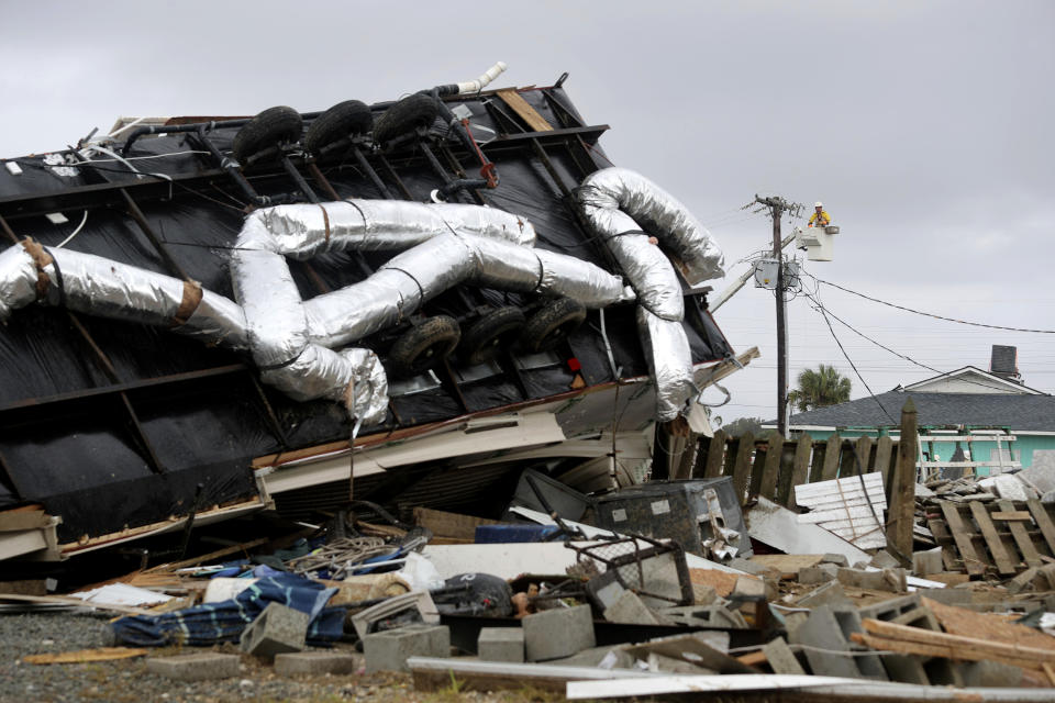 Power company lineman work to restore power after a tornado hit Emerald Isle, N.C. as Hurricane Dorian moved up the East coast on Sept. 5, 2019. (Photo: Tom Copeland/AP)