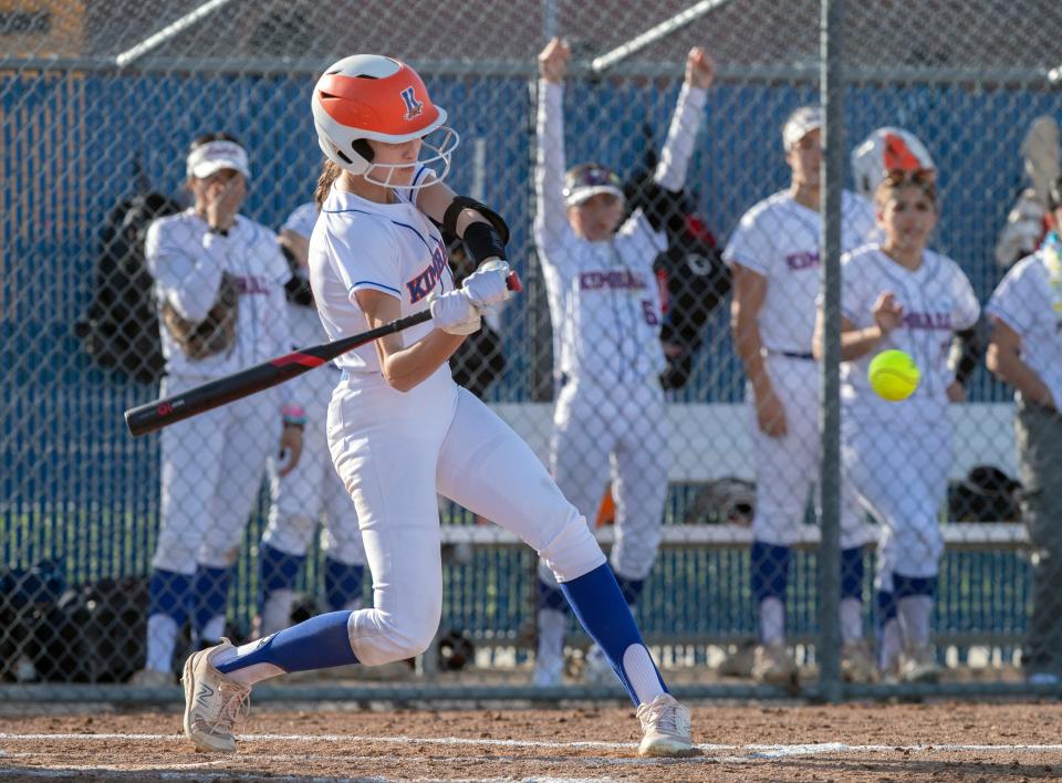 Kimball's Bianca Quintero hits a double during a girls varsity softball game against Lincoln at Kimball High in Tracy on Mar. 7, 2024. Pamplona was ruled safe. Kimball won 13-7.