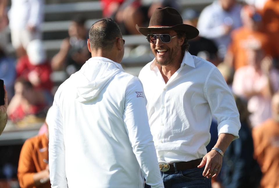 Longhorns coach Steve Sarkisian speaks with actor and entertainer Matthew McConaughey.