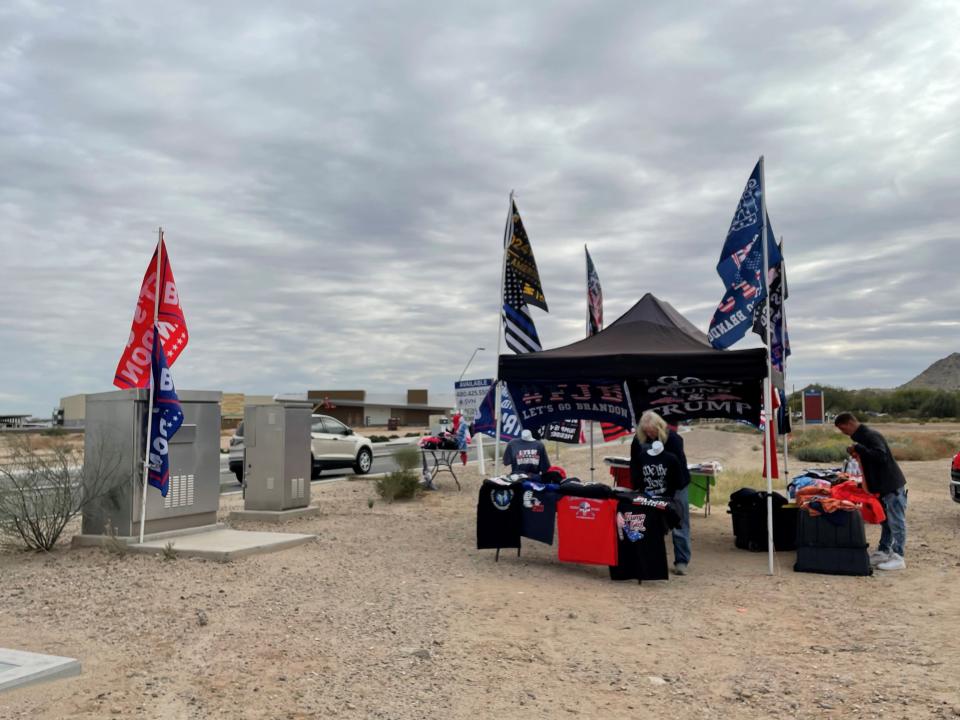 Vendors near Ellsworth Road  and Hunt Highway on Jan. 14, 2022, gear up for Donald Trump's Jan. 15 rally nearly 20 miles away in Florence.