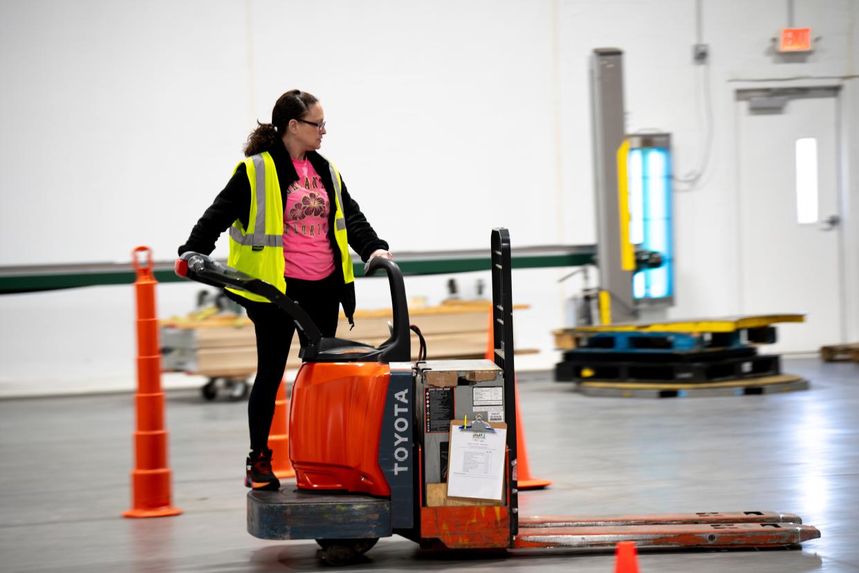 Cassie Reinecke of Hartwell drives a forklift on Feb. 20 during a Lift the Tristate workforce development class provided by the Freestore Foodbank nonprofit.