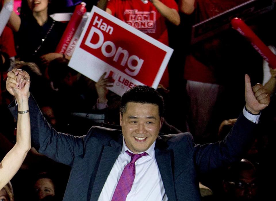 Now independent candidate Han Dong celebrates with supporters in Toronto in 2014 during a rally in Toronto while a Liberal candidate. Dong is one of the three men alleged to have ties to the Chinese government, cited by Diaspora groups raising safety concerns. He denies the allegations against him. 