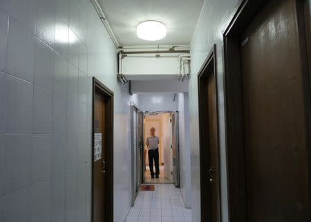 Landlord Ng Goon-lau, 66, poses inside his property where two suicides have taken place, in Hong Kong, China June 8, 2018. Picture taken June 8, 2018. REUTERS/Venus Wu