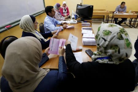 Officials count ballots after polls closed at a polling station for parliamentary elections in Amman, Jordan, September 20, 2016. REUTERS/Muhammad Hamed