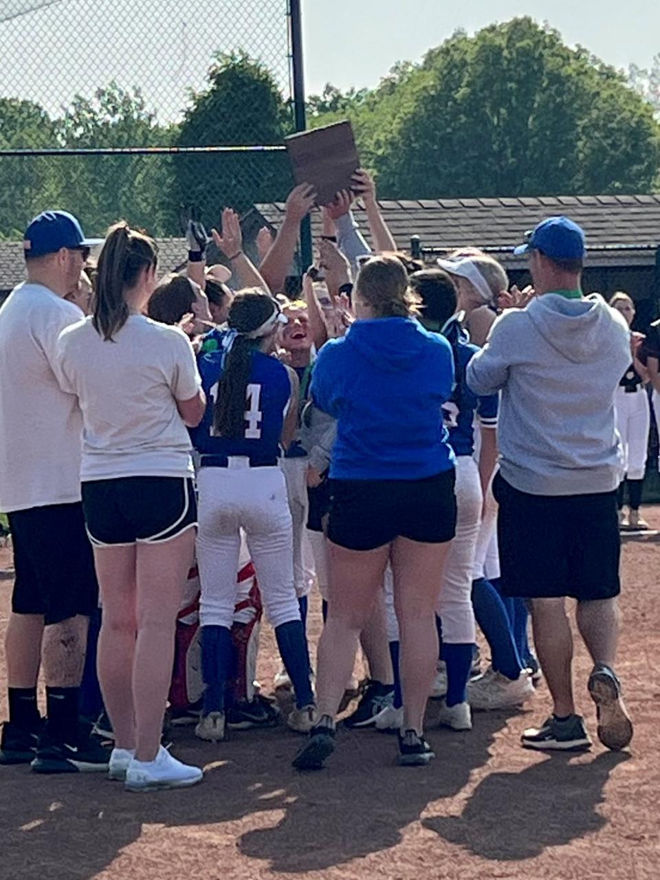 The Highland softball team celebrates its Division II district championship it earned last season at Pickerington Central.