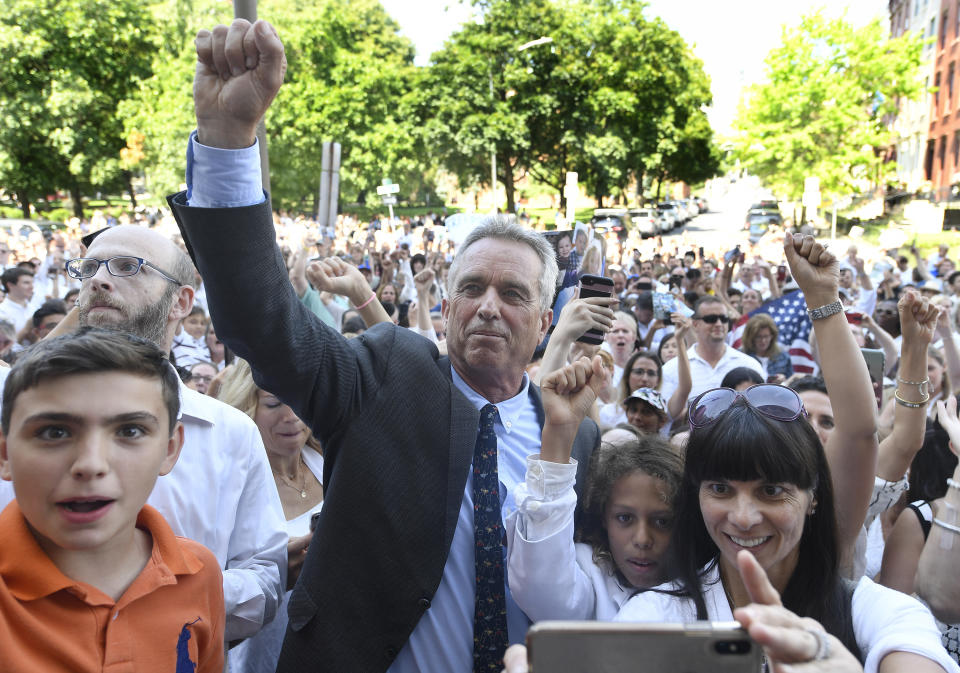 Attorney Robert F. Kennedy, Jr. poses for photographs with fans after speaking at a hearing challenging the constitutionality of the state legislature's repeal of the religious exemption to vaccination on behalf of New York state families who held lawful religious exemptions, during a rally outside the Albany County Courthouse Wednesday, Aug. 14, 2019, in Albany, N.Y. (AP Photo/Hans Pennink)