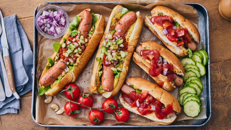 tray of hot dogs with condiments