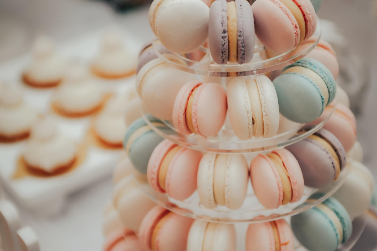 a lot of colorful macaroons at a festive banquet .