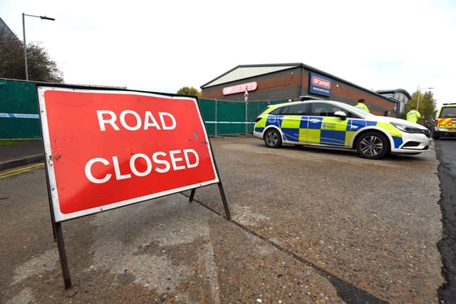 Police at the industrial estate in Grays, Essex, where 39 bodies were discovered in a lorry trailer