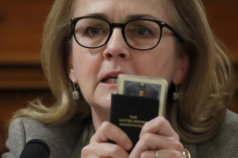 Rep. Madeleine Dean, D-Pa., holds a copy of the U.S. Constitution as she speaks during a House Judiciary Committee markup of the articles of impeachment against President Donald Trump, on Capitol Hill, Thursday, Dec. 12, 2019, in Washington. (AP Photo/Alex Brandon)