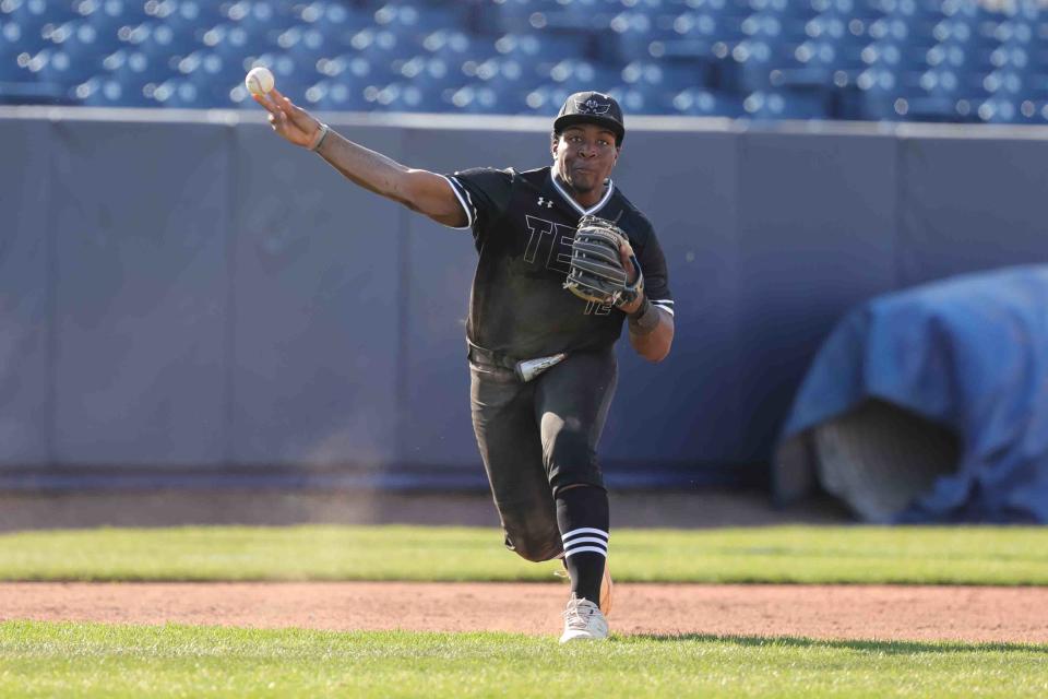 Sussex Tech infielder Jaryn Sample (12) fields the ball at third base against Salesianum.