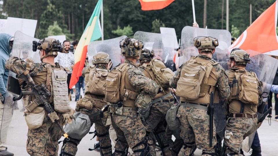 Marines with the 26th Marine Expeditionary Unit practice crowd-control techniques during a noncombatant evacuation operation simulation at Stone Bay, North Carolina, April 25. (Cpl. Kyle Jia/Marine Corps)