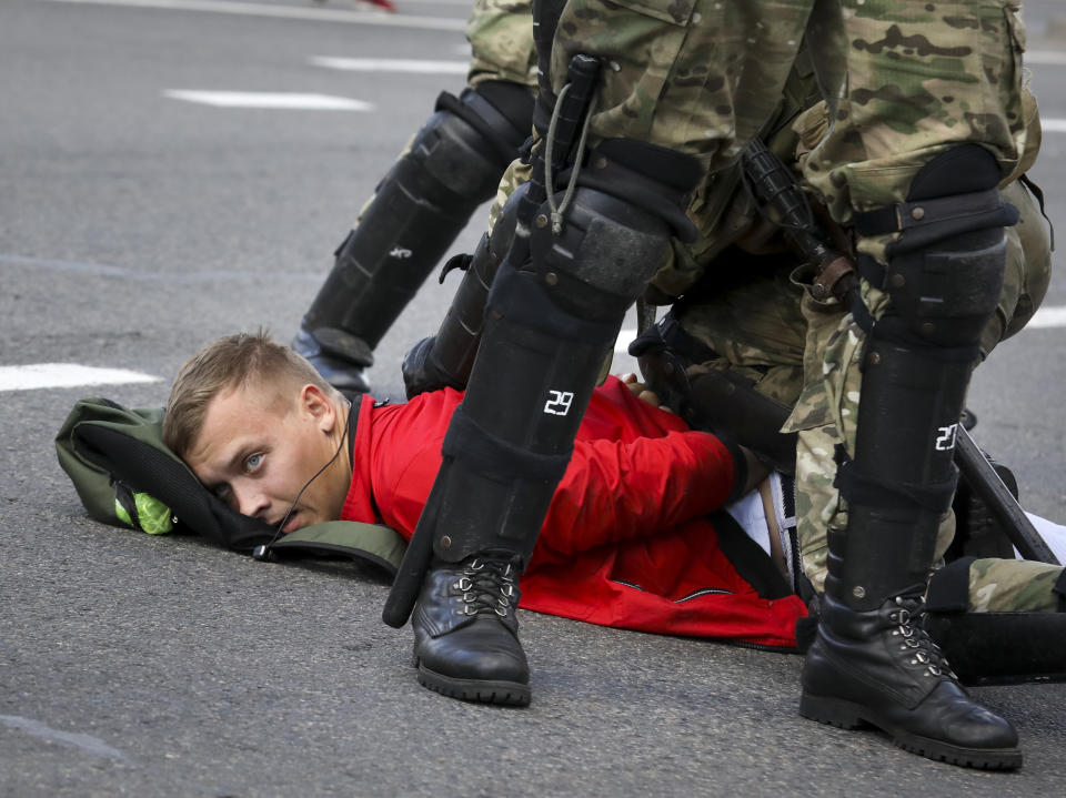 Riot police officers detain a protester during a Belarusian opposition supporters' rally protesting the official presidential election results in Minsk, Belarus, Sunday, Sept. 13, 2020. Protests calling for the Belarusian president's resignation have broken out daily since the Aug. 9 presidential election that officials say handed him a sixth term in office. (AP Photo)