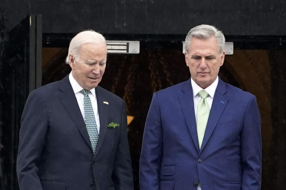 FILE - President Joe Biden talks with House Speaker Kevin McCarthy, R-Calif., as he departs the Capitol following the annual St. Patrick's Day gathering, in Washington, March 17, 2023. There are stark differences in how President Joe Biden and House Speaker Kevin McCarthy want to shore up the government's finances. The Democratic president primarily wants higher taxes on the wealthy to lower deficits; the GOP congressional leader favors sharp spending cuts. (AP Photo/J. Scott Applewhite, File)