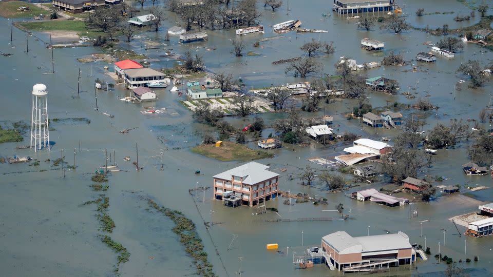 Buildings and homes flooded in the aftermath of Hurricane Laura in August 2020 near Lake Charles, Louisiana. - David J. Phillip/AP