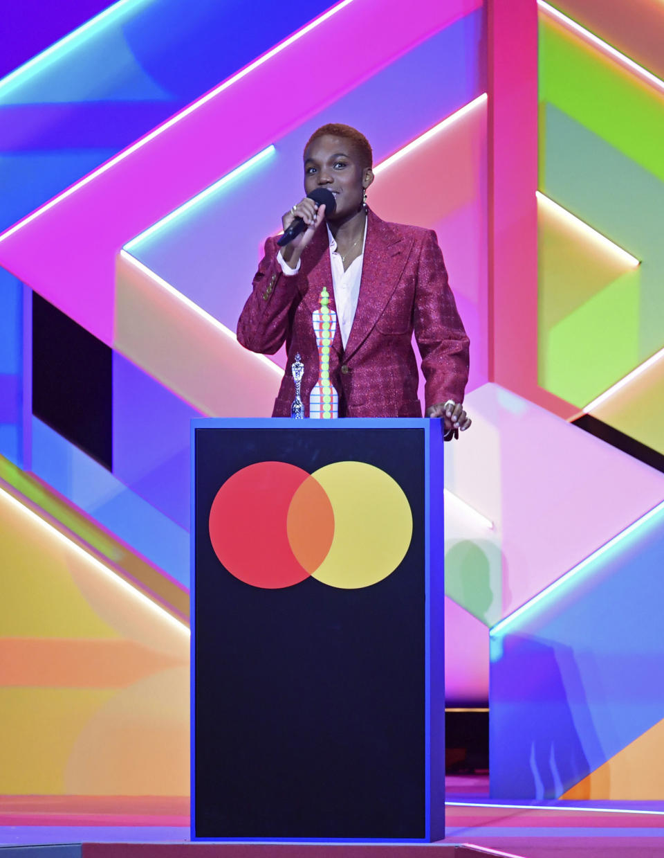 Arlo Parks accepts the award for Breakthrough Artist during the Brit Awards 2021 at the O2 Arena, London, Tuesday, May 11, 2021. (Ian West/PA via AP)
