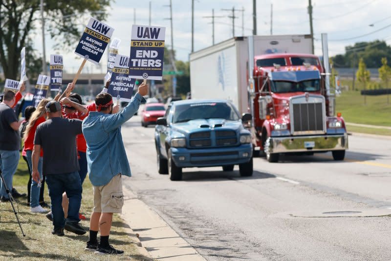 United Auto Workers strike outside an entrance to the Stellantis's factory where the Jeep Wrangler and Gladiator are built in Toledo, Ohio on Monday. Photo by Aaron Josefczyk/UPI