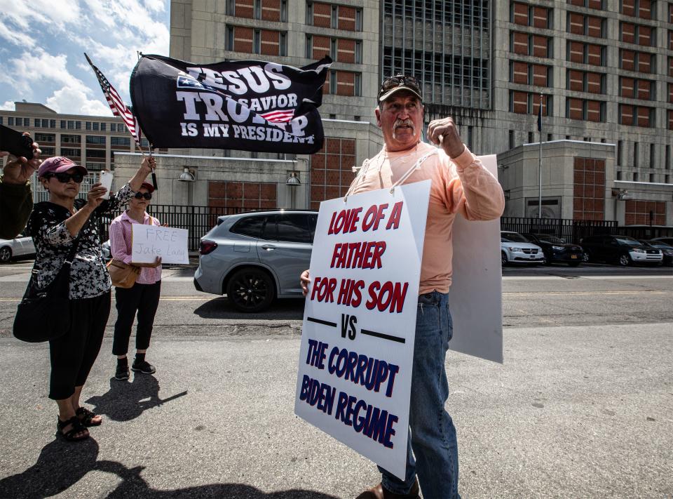 Ned Lang, father of Jake Lang, stands in front of the Metropolitan Detention Center in Brooklyn May 8, 2024 where his son his incarcerated. Jake Lang is a January 6 defendant who has been imprisoned since January 2021. Ned Lang was joined by several supporters as well as by Couy Griffin, founder of "Cowboys for Trump," who served two weeks in jail for his own part in the Capitol riot. Griffin had ridden up to the prison on horseback .