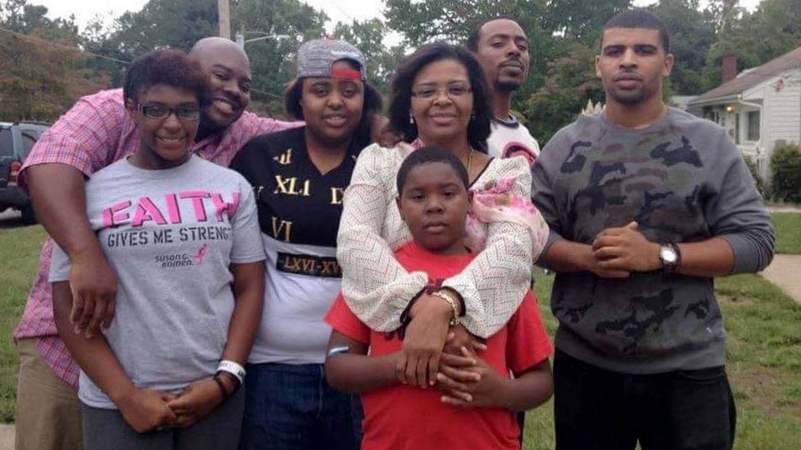 Ian Wells, center, surrounded by his family.