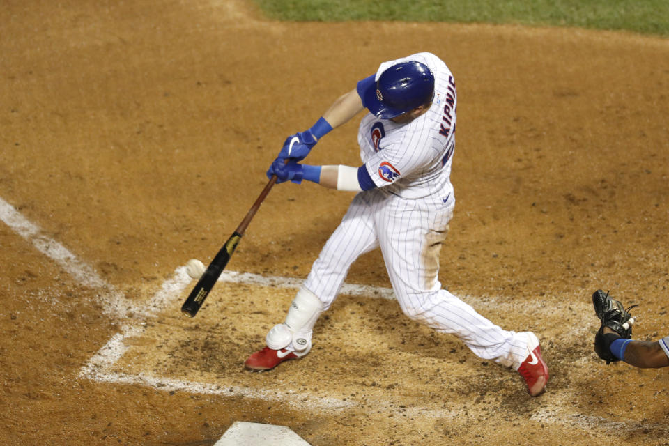 Chicago Cubs' Jason Kipnis hits a two-run home run off Kansas City Royals starting pitcher Brady Singer during the fourth inning of a baseball game Tuesday, Aug. 4, 2020, in Chicago. (AP Photo/Charles Rex Arbogast)