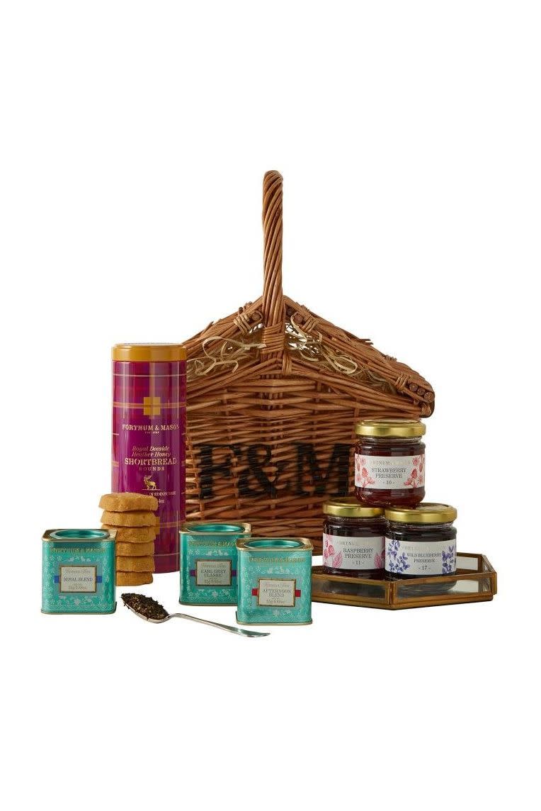 <p><strong>Fortnum & Mason</strong></p><p>williams-sonoma.com</p><p><strong>$100.95</strong></p><p>In this deluxe gift basket, you'll get famed British tea-maker Fortnum and Mason's most popular flavors like the Royal Blend, Earl Grey, and Afternoon Blend, along with delicious jams and a tin of honey shortbread.</p><p><strong>More:</strong> <a href="https://www.townandcountrymag.com/leisure/dining/g23937264/gourmet-food-gifts/" rel="nofollow noopener" target="_blank" data-ylk="slk:Gourmet Food Gifts for Everyone on Your List;elm:context_link;itc:0;sec:content-canvas" class="link ">Gourmet Food Gifts for Everyone on Your List</a></p>