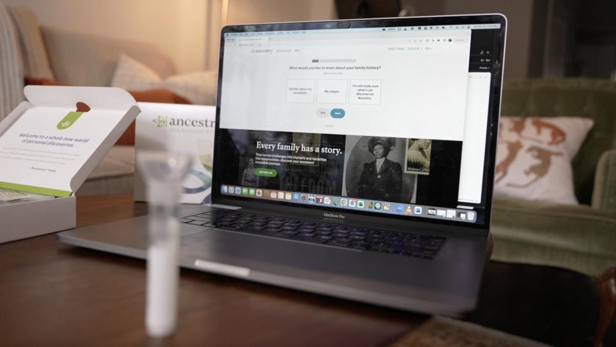 Ancestry.com is shown on a laptop screen