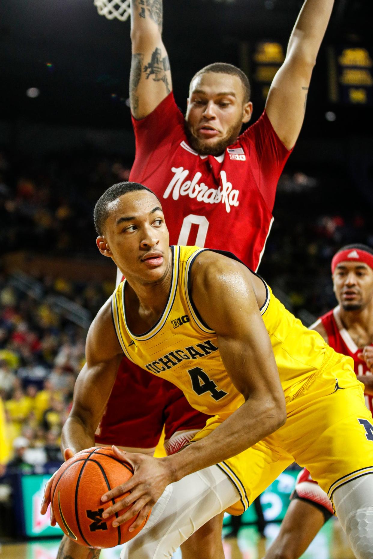 Michigan guard Nimari Burnett looks to pass against Nebraska guard C.J. Wilcher during the second half of U-M's 85-70 loss to Nebraska on Sunday, March 10, 2024, at Crisler Center.