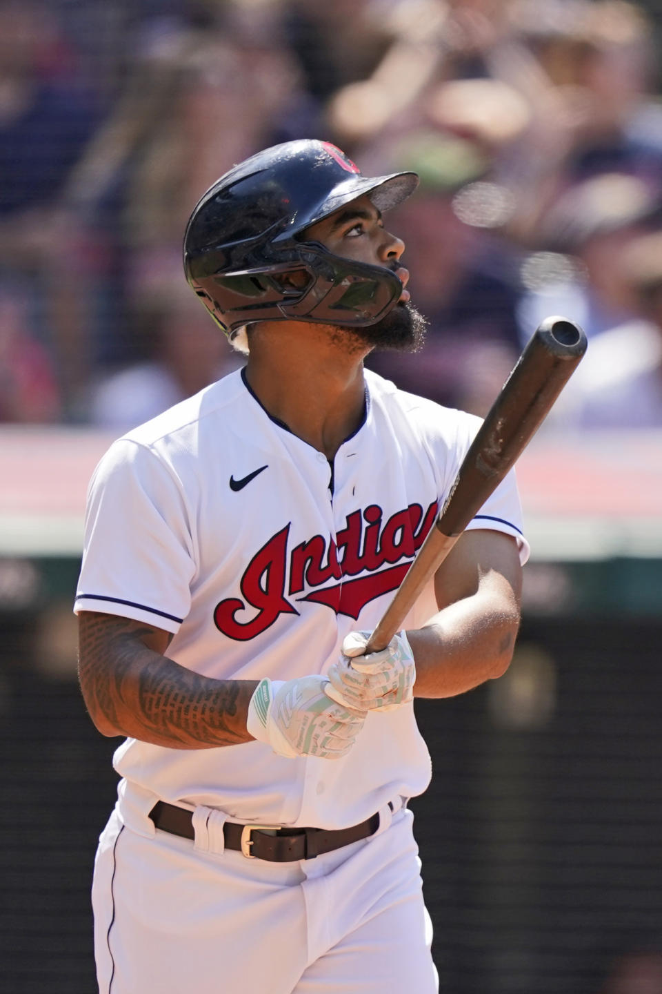 Cleveland Indians' Bobby Bradley watches his sacrifice fly in the eighth inning of a baseball game against the Tampa Bay Rays, Sunday, July 25, 2021, in Cleveland. Indians' Amed Rosario scored on the play. (AP Photo/Tony Dejak)