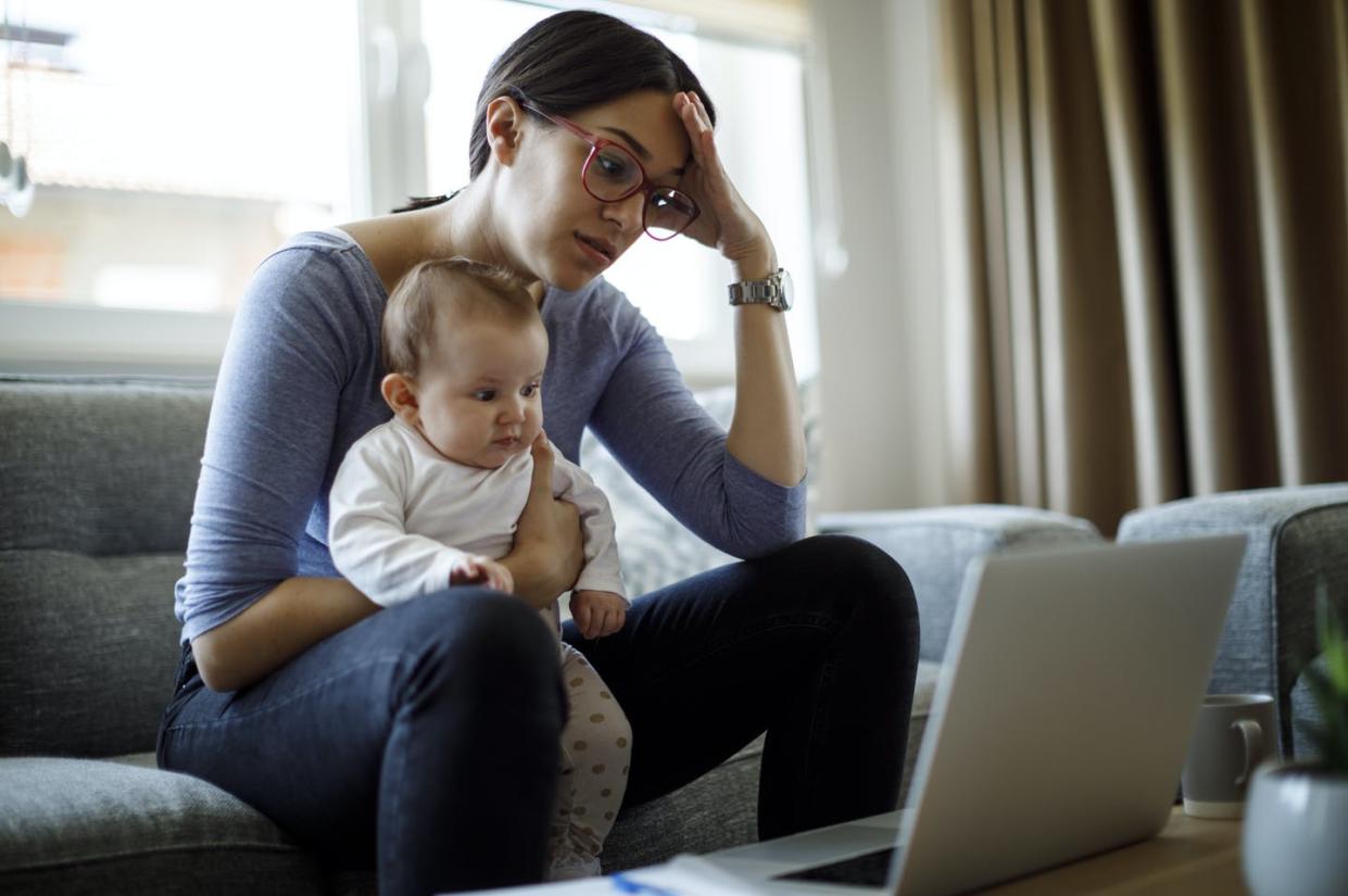 <span class="caption">Child care insecurity can increase stress and anxiety and decrease quality of life. </span> <span class="attribution"><a class="link " href="https://www.gettyimages.com/detail/photo/tired-young-mother-working-from-home-royalty-free-image/1220413419" rel="nofollow noopener" target="_blank" data-ylk="slk:Damir Cudic/E+ Collection via Getty Images;elm:context_link;itc:0;sec:content-canvas">Damir Cudic/E+ Collection via Getty Images</a></span>