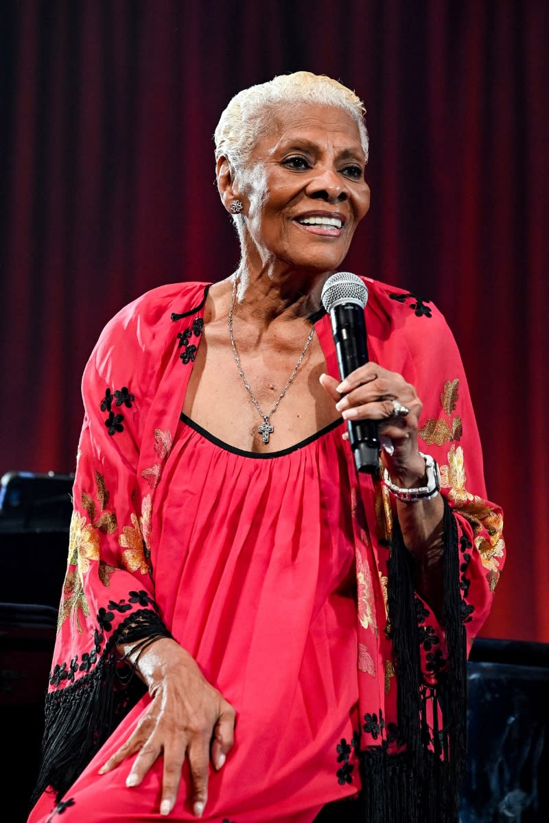 Dionne Warwick is pictured with grey hair whilst speaking onstage at the New York Restoration Project's 27th Annual Halloween Gala 