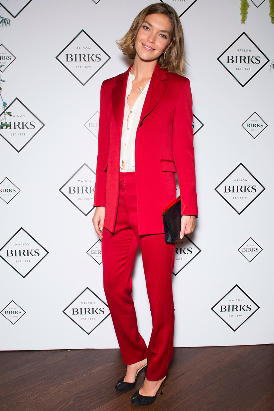 <p><strong>16 October</strong> Arizona Muse attended the UK launch of Birks in London wearing a red satin suit with Birks jewellery.</p>