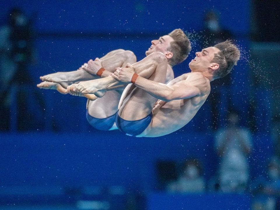 Great Britain's Tom Daley and Matty Lee flip during synchronized diving.