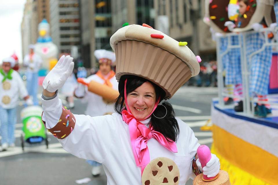 A performer dressed as a cookie with the Deck the Halls Float smiles while entertaining the crowd along the parade route in the 93rd Macy's Thanksgiving Day Parade in New York. (Photo: Gordon Donovan/Yahoo News)