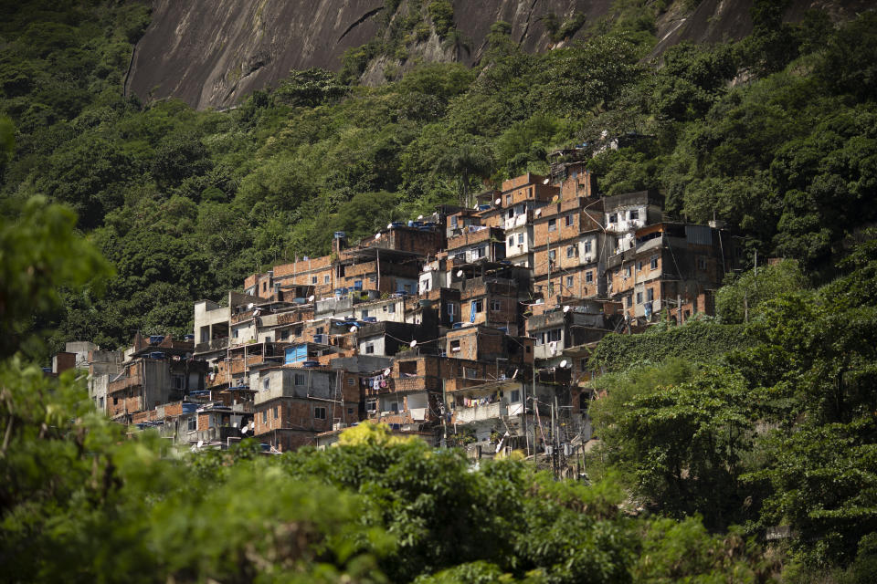 The Rocinha favela stands out from a hillside in Rio de Janeiro, Brazil, on March 16, 2020. Rocinha, Brazil's largest favela, is home to about 70,000 people, as of the latest census. Brazil's neglect of favela residents could make favelas hot spots for outbreaks of COVID-19. (Photo: AP Photo/Silvia Izquierdo)