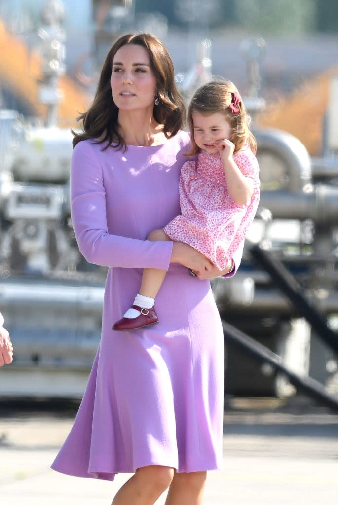 HAMBURG, GERMANY - JULY 21:  Princess Charlotte of Cambridge and Catherine, Duchess of Cambridge view helicopter models H145 and H135 before departing from Hamburg airport on the last day of their official visit to Poland and Germany on July 21, 2017 in Hamburg, Germany.  (Photo by Karwai Tang/WireImage)