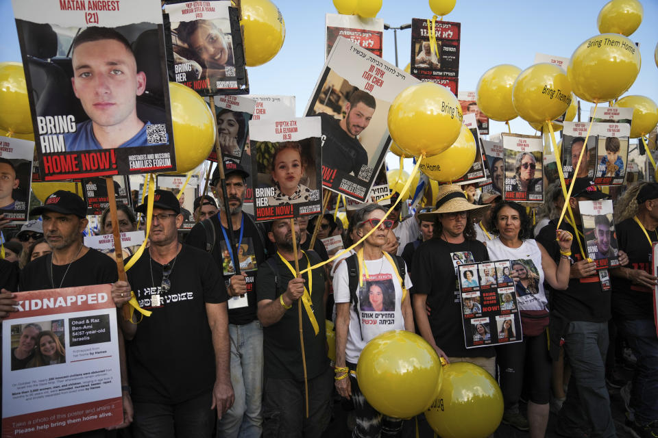 Family and supporters of the estimated 240 hostages held by Hamas in Gaza complete the final leg of a five-day solidarity rally calling for their return, from Tel Aviv to the Prime Minister's office in Jerusalem, Saturday, Nov. 18, 2023. The hostages, mostly Israeli citizens, were abducted during the brutal Oct. 7 Hamas cross-border attack in Israel and have been held in the enclave since as war rages. (AP Photo/Mahmoud Illean)