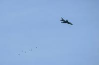 A Syrian air force Su-17 fighter plane seen over the besieged rebel-held town of Hamouria in the eastern Ghouta region on March 3, 2018