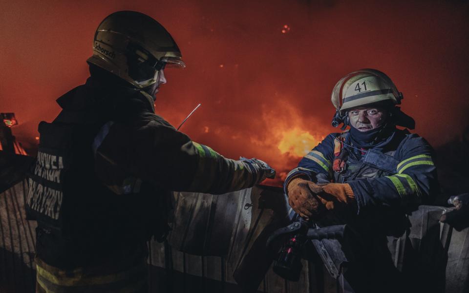 Emergency service workers extinguish a fire in a house after a Russian shelling in Kostiantynivka, Ukraine - Anadolu Agency/Anadolu Agency