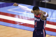 Washington Wizards' Russell Westbrook gestures to fans during the first quarter against the Houston Rockets in an NBA basketball game Tuesday, Jan. 26, 2021, in Houston. (Carmen Mandato/Pool Photo via AP)