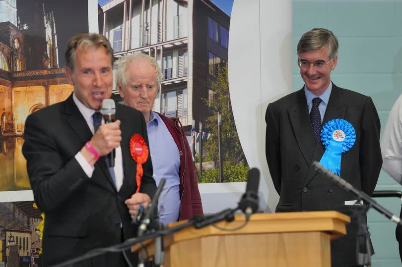 Labour's Dan Norris speaks after winning the seat in the North East Somerset and Hanham constituency in the 2024 General Election, watched by loser Sir Jacob Rees-Mogg