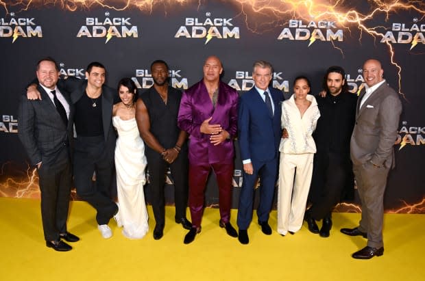 Beau Flynn, Noah Centineo, Sarah Shahi, Aldis Hodge, Dwayne Johnson aka The Rock, Pierce Brosnan, Quintessa Swindell, Marwan Kenzari and Hiram Garcia attend the UK Premiere of "Black Adam" <p><a href="https://www.gettyimages.com/detail/1434503852" rel="nofollow noopener" target="_blank" data-ylk="slk:Dave J Hogan/Getty Images;elm:context_link;itc:0;sec:content-canvas" class="link ">Dave J Hogan/Getty Images</a></p>