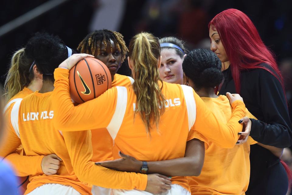 Tennessee center Tamari Key (20) huddles with teammates before the start of the NCAA college basketball game against Wright State on Sunday, December 11, 2022 in Knoxville, Tenn. 