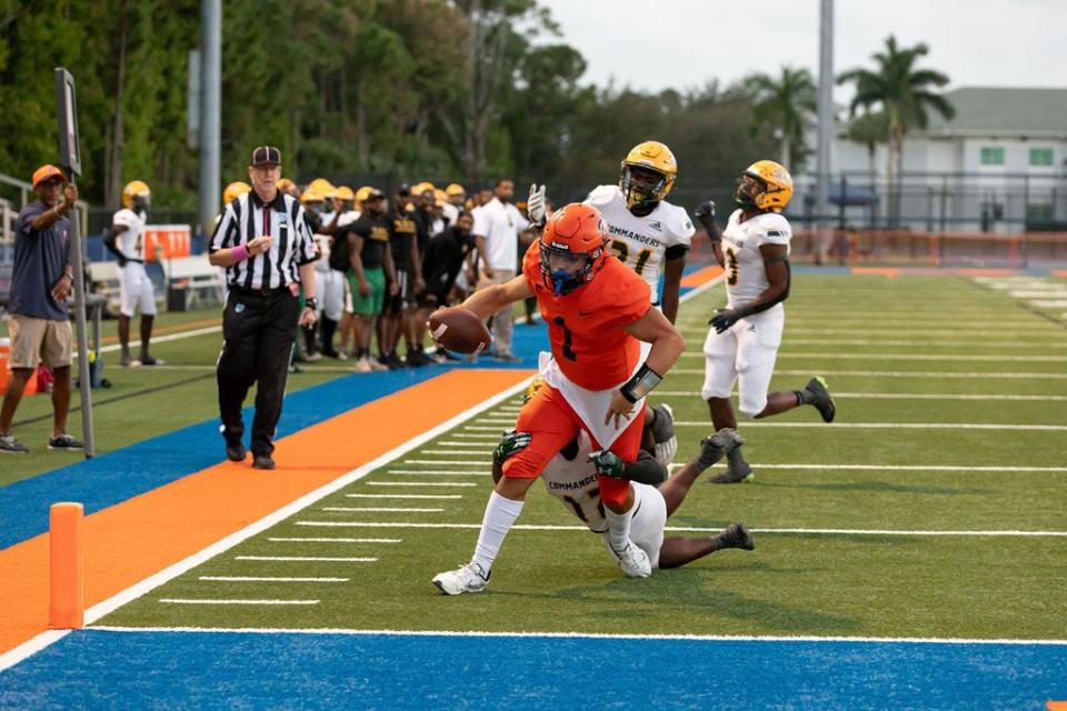 Benjamin football quarterback Jayden Vega (1) dives for the end zone during a game against Ed White (Jacksonville) on Friday, Oct. 27, 2023.