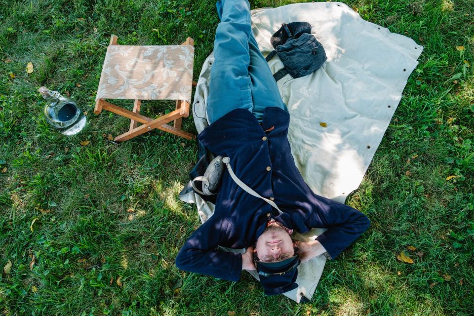 Duncan Virostko, of Cleveland, naps during a special Civil War School Days event for school-aged children, Friday, Sept. 15 in Zoar.