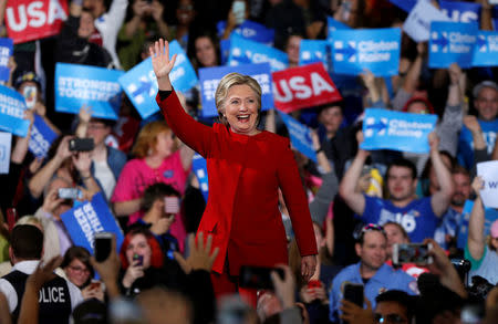 Hillary Clinton waves to supporters at the Grand Valley State University Fieldhouse in Allendale, Michigan. REUTERS/Rebecca Cook