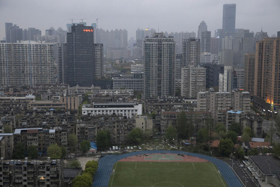 A view of the city of Wuhan taken from a quarantine hotel in central China's Hubei province on Monday, March 30, 2020. Shopkeepers in the city at the center of China's virus outbreak were reopening Monday but customers were scarce after authorities lifted more of the anti-virus controls that kept tens of millions of people at home for two months. (AP Photo/Ng Han Guan)