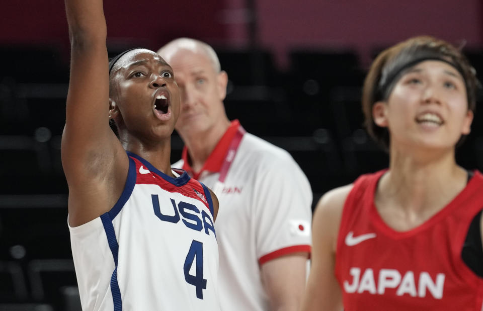 United States' Jewell Loyd (4), left, reacts as she watches a shot during women's basketball preliminary round game at the 2020 Summer Olympics, Friday, July 30, 2021, in Saitama, Japan. (AP Photo/Eric Gay)