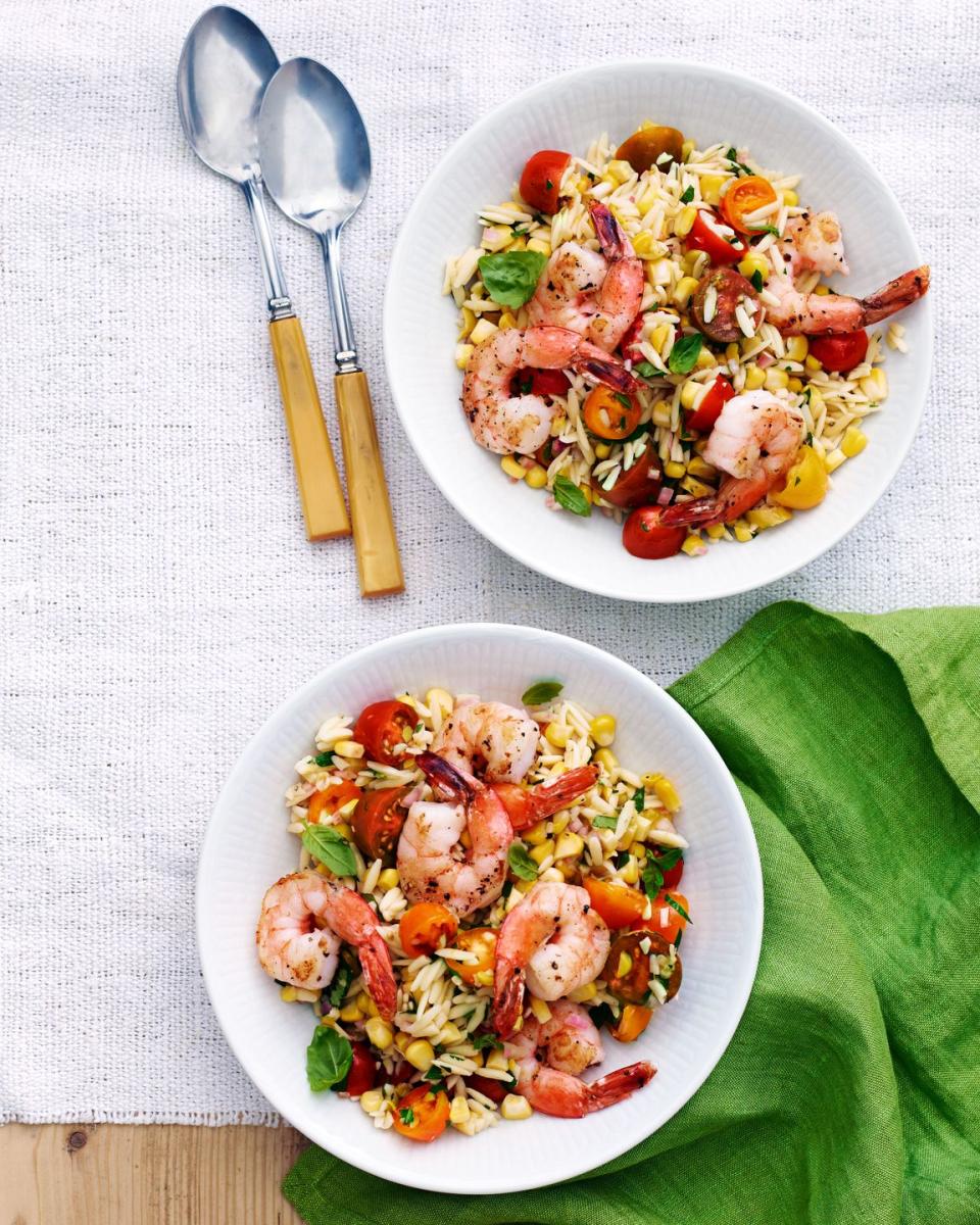 a couple plates of summer orzo with shrimp