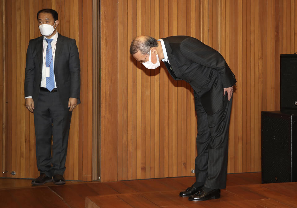 Hong Won-sik, chairman of Namyang Dairy Products, bows in apology during a press conference at the company's headquarters in Seoul, South Korea, Tuesday, May 4, 2021. Hong resigned over a scandal in which his company was accused of deliberately spreading misinformation that its yogurt helps prevent coronavirus infections. (Hwang Gang-mo/Yonhap via AP)